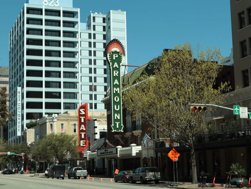 Courthouse imagery alongside Hollywood studio symbols representing the legal fight over the Paramount-Warner Bros. Disco