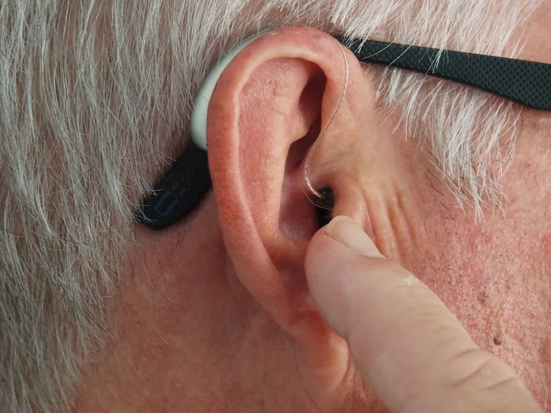 People wearing earplugs at a concert to protect their hearing