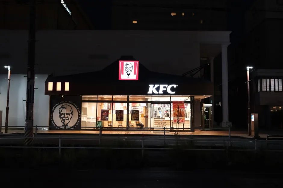 KFC popcorn chicken served in branded packaging at a restaurant counter