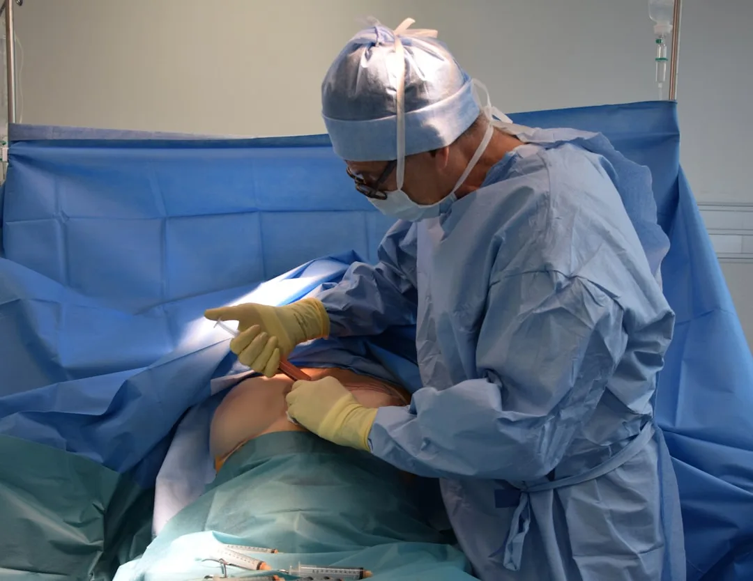 Orthopedic surgeon discussing knee surgery options with a patient