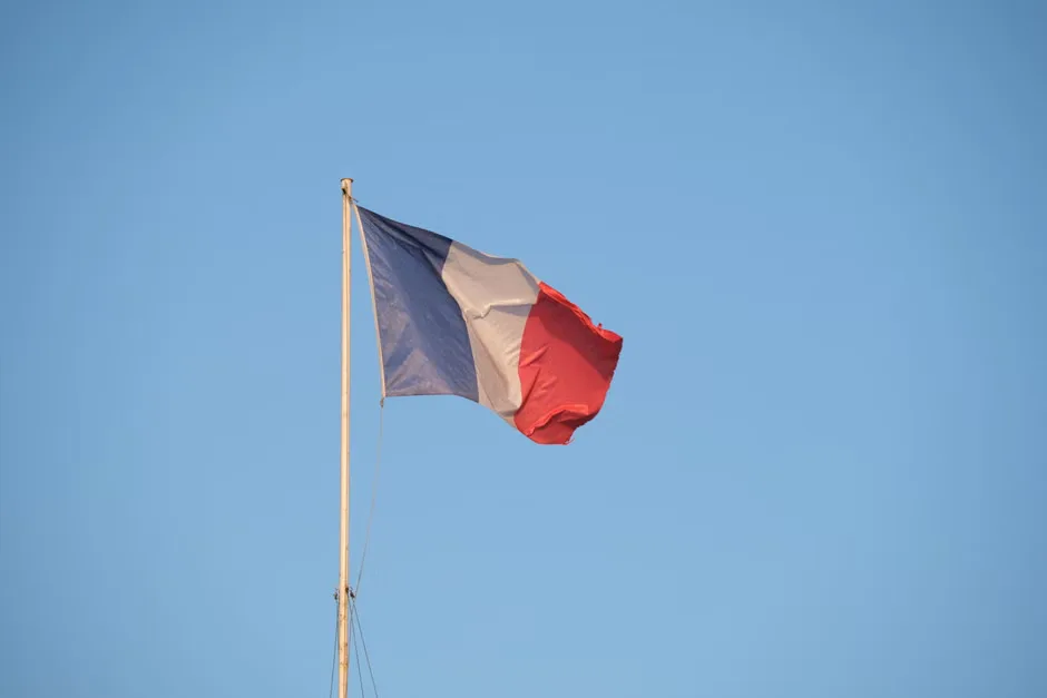 French flags outside a government building as Marine Le Pen’s sentencing reshapes the 2027 presidential race.