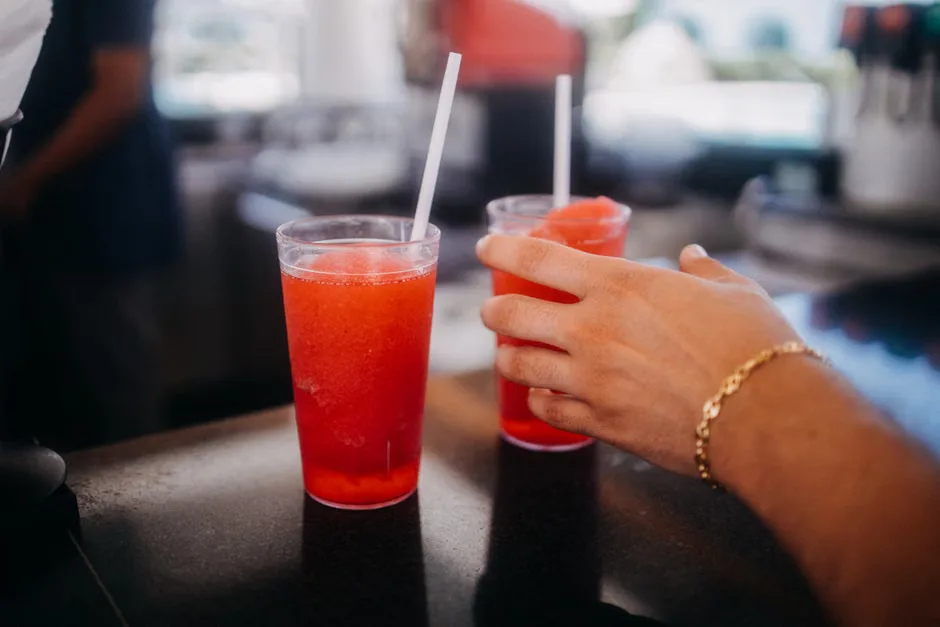Ninja Slushi Twist-style countertop frozen drink machine in a kitchen during summer heat