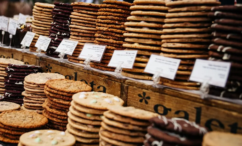 Laptop showing an online shopping page with abstract cookie and affiliate tracking graphics