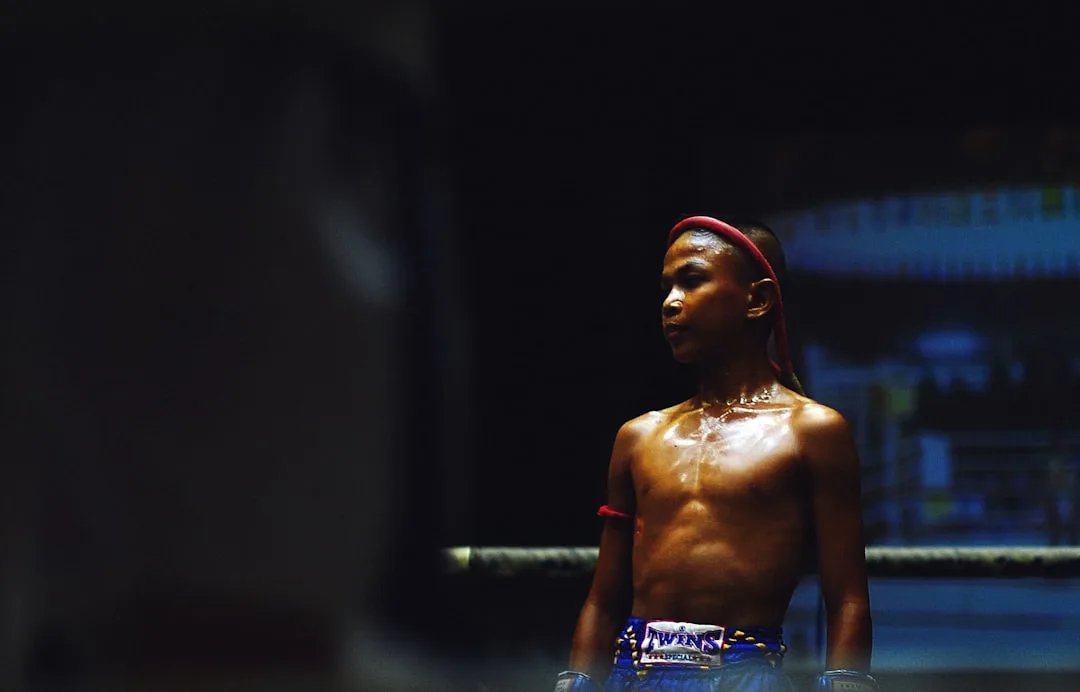 Shakur Stevenson and Gervonta Davis during a stylized pre-fight faceoff in a boxing arena.