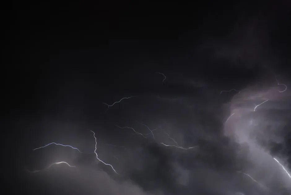 Dark storm clouds gather over a roadway in the Ozarks ahead of possible severe weather.