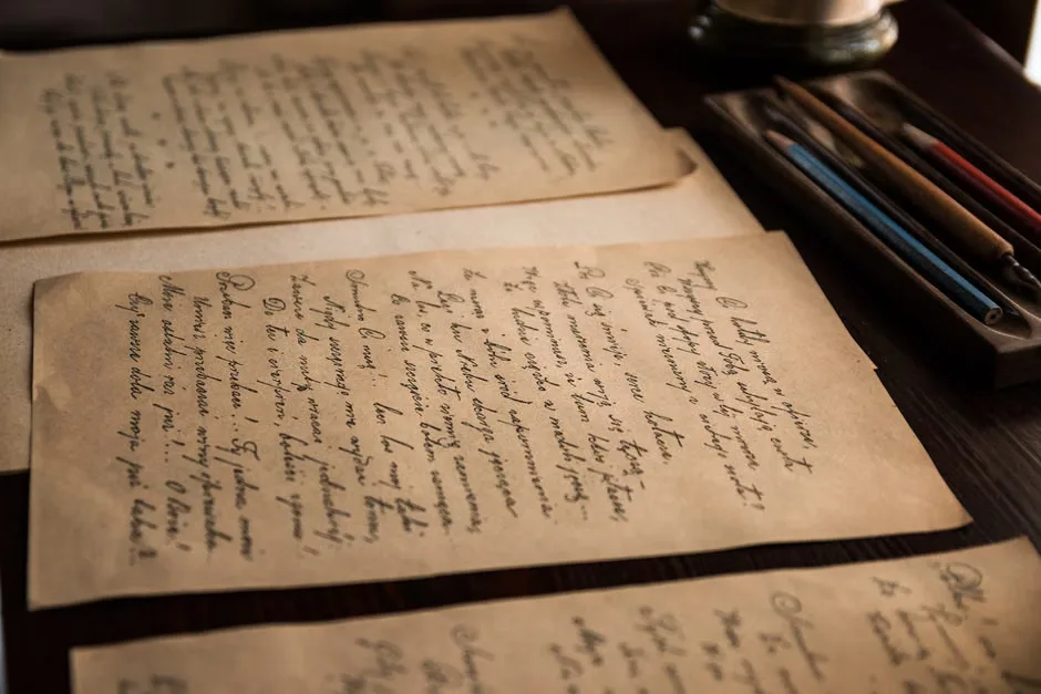 Vintage letters and old books representing Tolkien memorabilia sold at auction