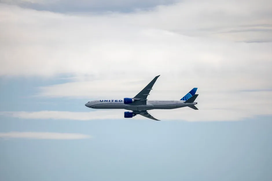 A United Airlines airplane on a runway at sunset