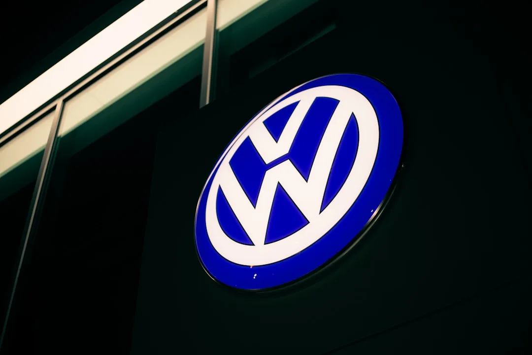 Volkswagen branding outside a corporate office as the automaker weighs deeper job cuts amid cost pressure.